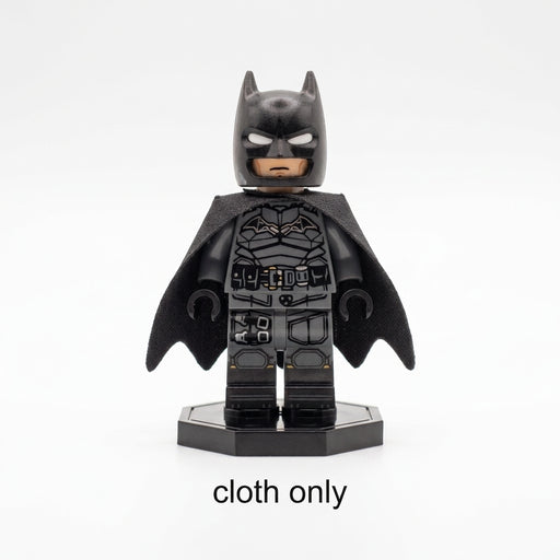 LEGO Batman Dark Knight minifigure wearing a shiny black over-the-shoulder cloth cape with scalloped bat-wing edges