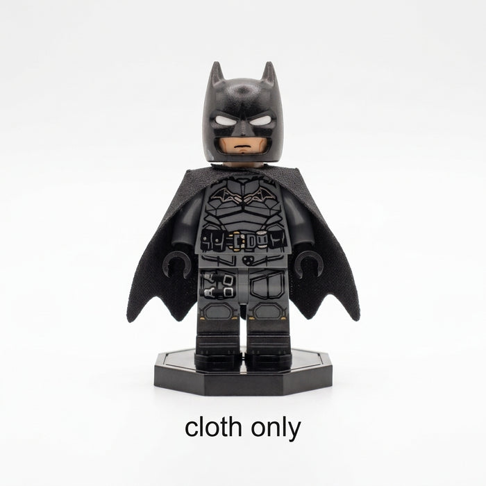 LEGO Batman Dark Knight minifigure wearing a shiny black over-the-shoulder cloth cape with scalloped bat-wing edges